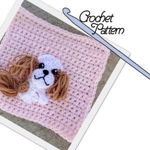 May include: A pink crochet square with a white crocheted dog applique. The dog has brown yarn for ears and tail. The crochet hook is visible in the upper right corner of the image. "Crochet Pattern" is written in black text on a white background.