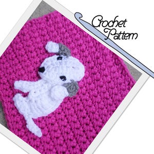 May include: A crochet pattern featuring a pink crocheted background with a white crocheted dog applique. The text "Crochet Pattern" is visible in the image.