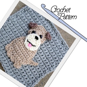 May include: A crochet pattern featuring a gray square with a brown dog applique. The dog has a white face with black eyes and a pink tongue. The text "Crochet Pattern" is written in blue above the square.