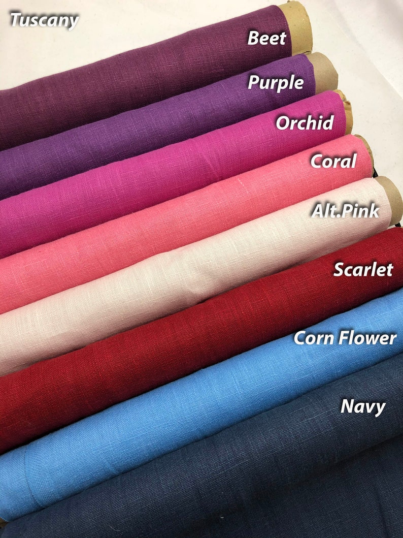 May include: A collection of eight fabric swatches rolled up and stacked on top of each other. The swatches are in the following order from top to bottom: Tuscany, Beet, Purple, Orchid, Coral, Alt.Pink, Scarlet, Corn Flower, Navy.