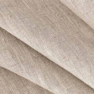 May include: Close-up of a folded piece of beige linen fabric with a textured weave.