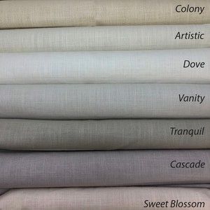 May include: Close-up of eight fabric swatches in various shades of beige, gray, and white. The swatches are labeled with the names "Colony", "Artistic", "Dove", "Vanity", "Tranquil", "Cascade", "Sweet Blossom".