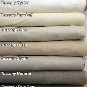 May include: Eight fabric swatches in various shades of gray, from white to dark gray. The swatches are labeled with the names 'Tuscany White', 'Tuscany Oyster', 'Tuscany Eggshell', 'Tuscany Dune', 'Tuscany Linen', 'Tuscany Gleam', 'Tuscany Natural', and 'Tuscany True Grey'.