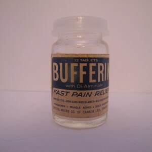 May include: A glass bottle with a white plastic lid containing 12 tablets of Bufferin Fast Pain Relief with Di-Alminate. The label is brown with blue text and lists headaches, muscle aches, and colds as uses.