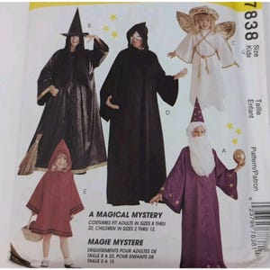 May include: A sewing pattern envelope titled A MAGICAL MYSTERY featuring illustrations of five costumes: a black witch robe with a hat, a black hooded cloak, a white angel dress with gold wings, a red hooded poncho, and a purple wizard robe with stars.