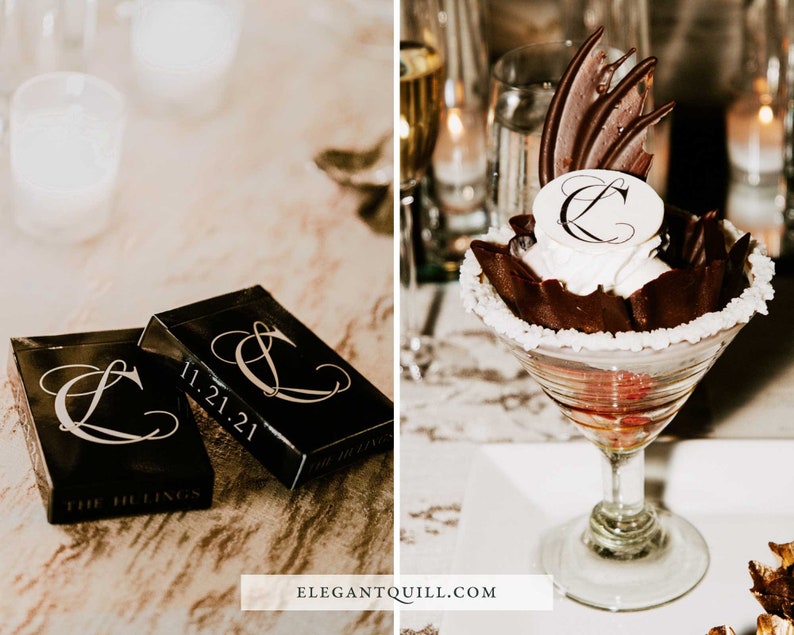 May include: Two black playing card boxes with the date 11.21.21 and the letter "L" in a decorative font. The boxes are on a wooden table. A chocolate dessert with a white chocolate topping with the letter "L" in a decorative font is in a martini glass on a white surface.