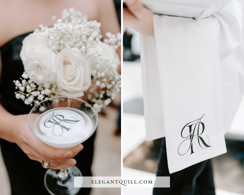 May include: A white cocktail glass with a monogrammed sticker on the bottom. The glass is being held by a person wearing a black dress and holding a bouquet of white roses and baby's breath. A white towel with a monogrammed design is in the background.