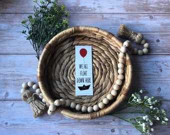 We All Float Down Her - It Lesezeichen