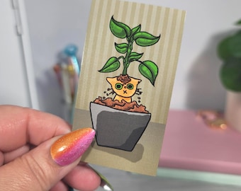 Orange Cat In Potted Plant Fridge Magnet