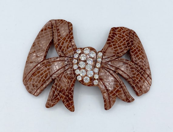 Vintage Celluloid and Rhinestone Bow Pin - image 1