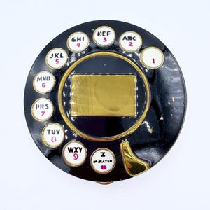 Vintage Schiaparelli Salvador Dali zwart emaille telefoon wijzerplaat poeder compact