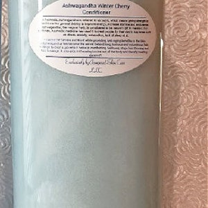 May include: A blue plastic bottle of Ashwagandha Winter Cherry Conditioner. The label includes the product name and a description of the benefits of the product.
