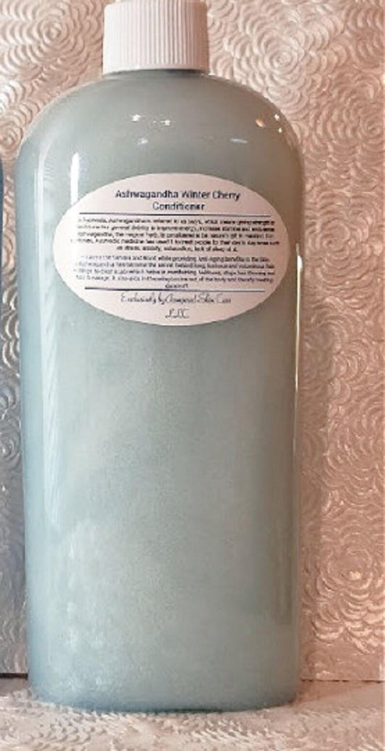 May include: A blue plastic bottle of Ashwagandha Winter Cherry Conditioner. The label includes the product name and a description of the benefits of the product.