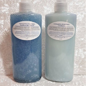 May include: Two blue plastic bottles with white labels. The labels contain the text "Ashwagandha Water Cherry Shampoo & Skin Cleanser" and "Ashwagandha White Cherry Conditioner".