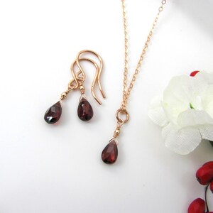 Garnet necklace and earring set in rose gold filled. Minimal and dainty with natural garnet pear briolettes in a simple drop style.