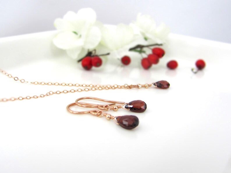 Garnet necklace and earring set in rose gold filled. Minimal and dainty with natural garnet pear briolettes in a simple drop style.
