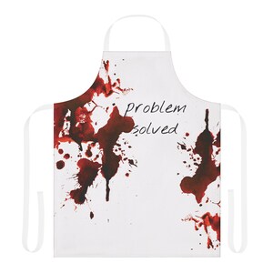 Peut inclure: Tablier blanc avec des éclaboussures de peinture rouge et le texte "problème résolu" en noir.