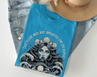 Ocean Does Not Apologize T-Shirt | Salt and Storms She is Made Of Shirt | Empowering Sea Goddess Quote Tee | Mystical Ocean Lover Gift