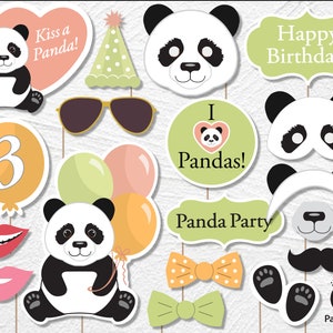 May include: A set of 12 panda-themed photo booth props for a birthday party. The props include a panda face, a panda mask, a panda head, a panda holding balloons, a panda with a party hat, a panda with a heart that says "I love Pandas!" and more. The props are printed on white cardstock and have sticks attached to the back.