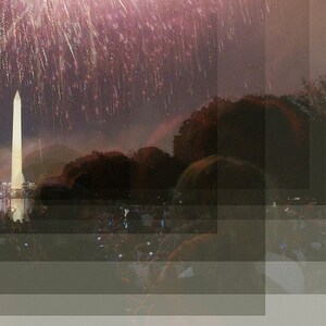 May include: A view of the Washington Monument with fireworks exploding in the sky above. The monument is lit up and reflected in the water below. People are gathered in the foreground, watching the fireworks.
