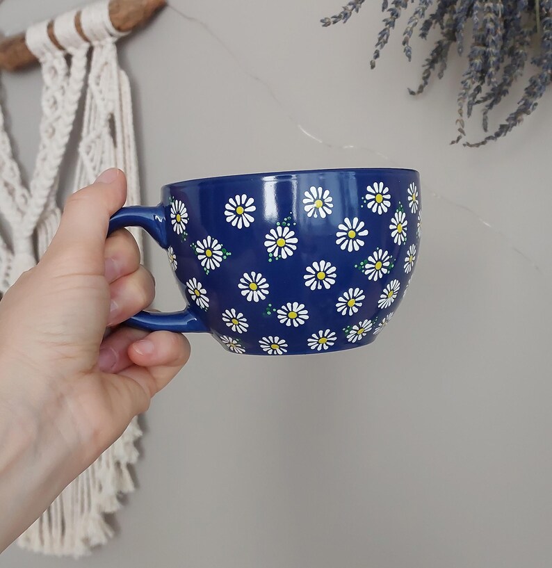 Side angle of the daisy mug showing its rounded shape and handle