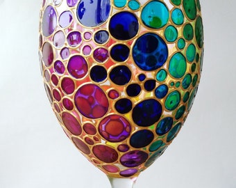 Hand painted wine glass with rainbow multi colored bubbles design