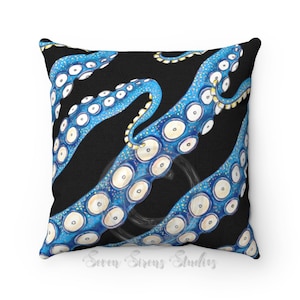 May include: A black and blue throw pillow with a repeating pattern of an octopus tentacle. The tentacle is blue with white circles and yellow accents.