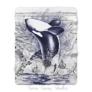 May include: A blue and white watercolor illustration of an orca jumping out of the water. The orca is superimposed on an antique nautical map with text in German. The map features a compass rose and a ship.