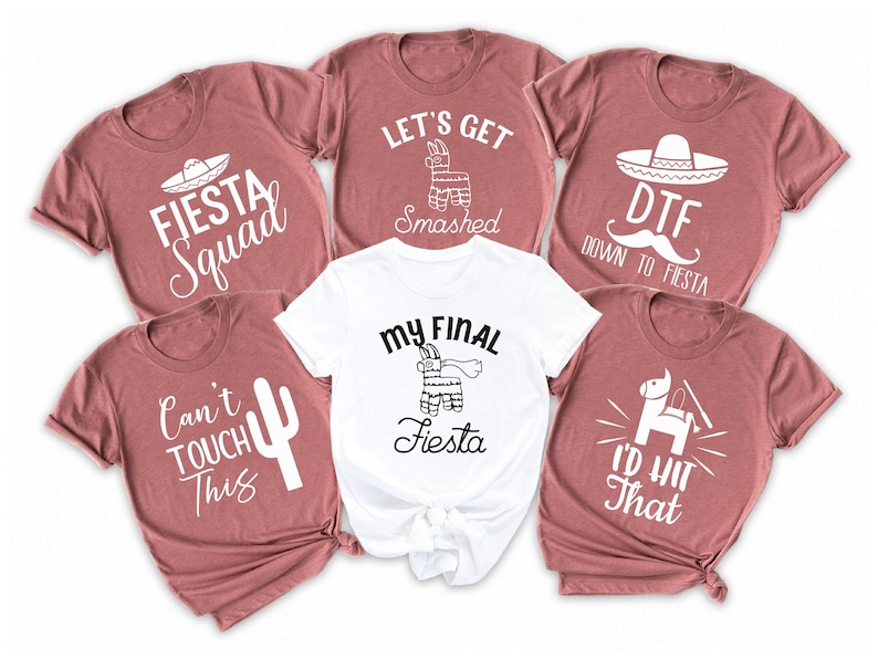 May include: Six t-shirts with different designs and text related to a fiesta. The shirts are in various shades of pink and white. The text on the shirts includes "Fiesta Squad", "Let's Get Smashed", "My Final Fiesta", "DTF Down to Fiesta", "Can't Touch This", and "I'd Hit That".