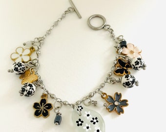 Sea glass bracelet - Black and white flowers - hand painted silverplated dangly charm bracelet 8 inches adjustable