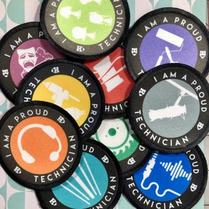 May include: A collection of round, black and white patches with the text "I am a proud technician" and various icons related to different technical fields. The icons include a microphone, headphones, paint roller, camera, and more.