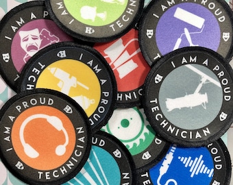 May include: A collection of round, black and white patches with the text "I am a proud technician" and various icons related to different technical fields. The icons include a microphone, headphones, paint roller, camera, and more.