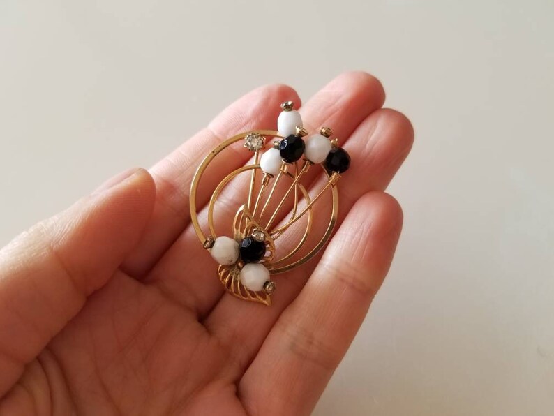 Gold Tone vintage Circle BroochPin with crystals and black and white beads