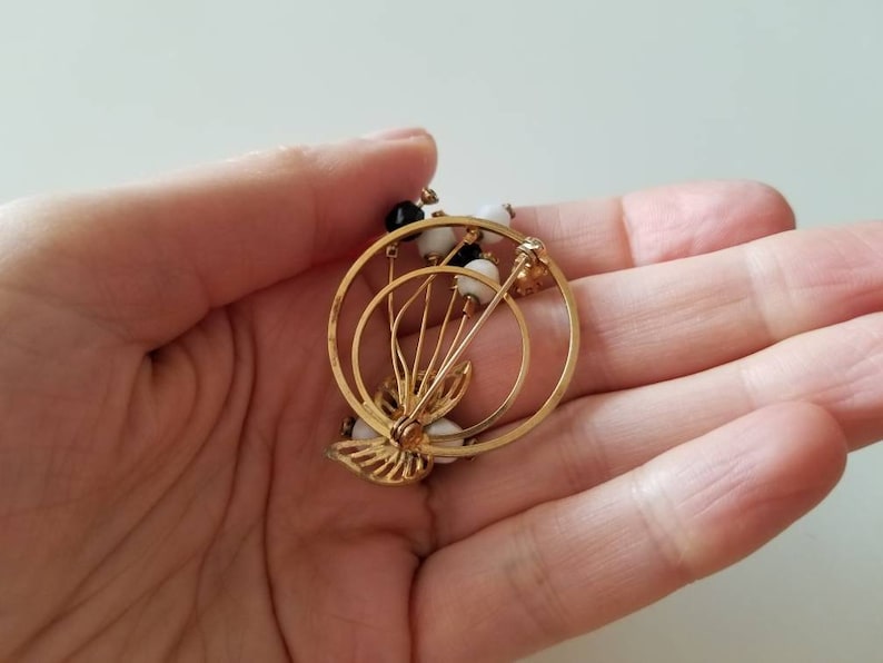 Gold Tone vintage Circle BroochPin with crystals and black and white beads