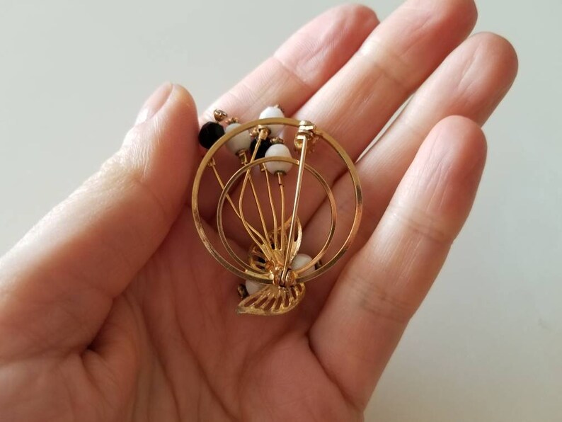 Gold Tone vintage Circle BroochPin with crystals and black and white beads