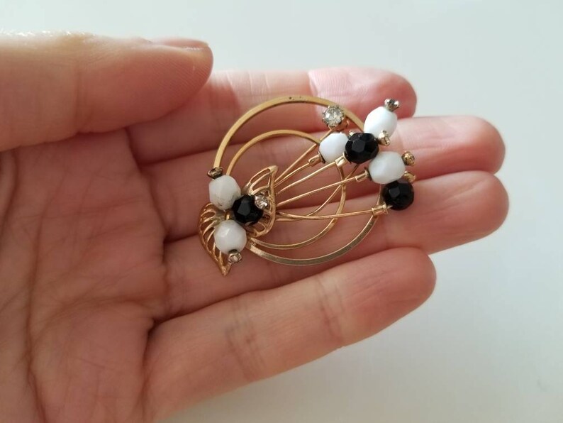 Gold Tone vintage Circle BroochPin with crystals and black and white beads
