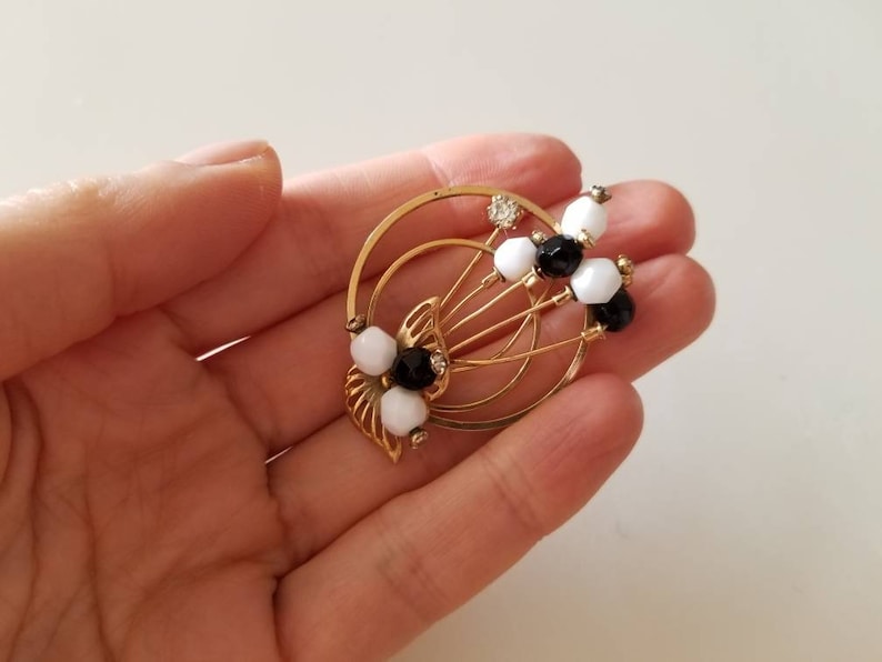 Gold Tone vintage Circle BroochPin with crystals and black and white beads
