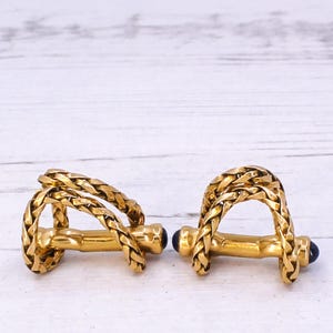 BOUCHERON Manschettenknöpfe mit rundem Saphir, um 1950