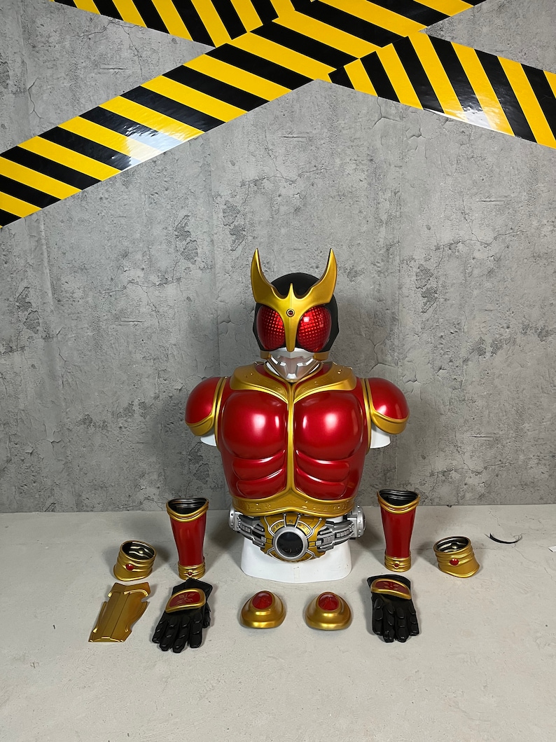 May include: A red and gold action figure with a helmet and a belt. The figure is disassembled and laid out on a white surface. The figure includes a chest piece, two arms, two legs, two gloves, two wrist pieces, and two shoulder pieces.
