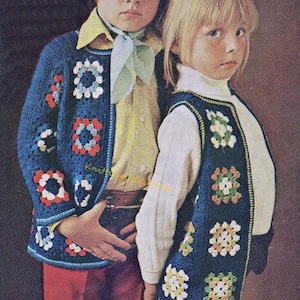 May include: Two children wearing crocheted vests with colorful granny squares. The boy is wearing a blue vest with red, white, and blue squares. The girl is wearing a blue vest with yellow, white, and green squares.