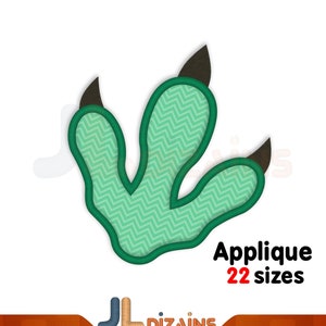 May include: A green dinosaur footprint applique with a zigzag pattern, outlined in dark green, and featuring brown claws. The text "Applique 22 sizes" is displayed in red and black. The logo "JL Dizains" is at the bottom.