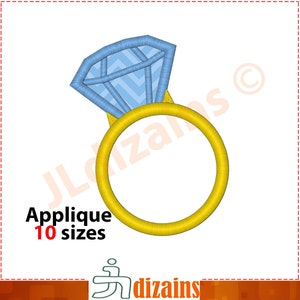 May include: A gold ring with a blue diamond on top. The ring is a simple design with a smooth band. The diamond is a classic shape with facets.
