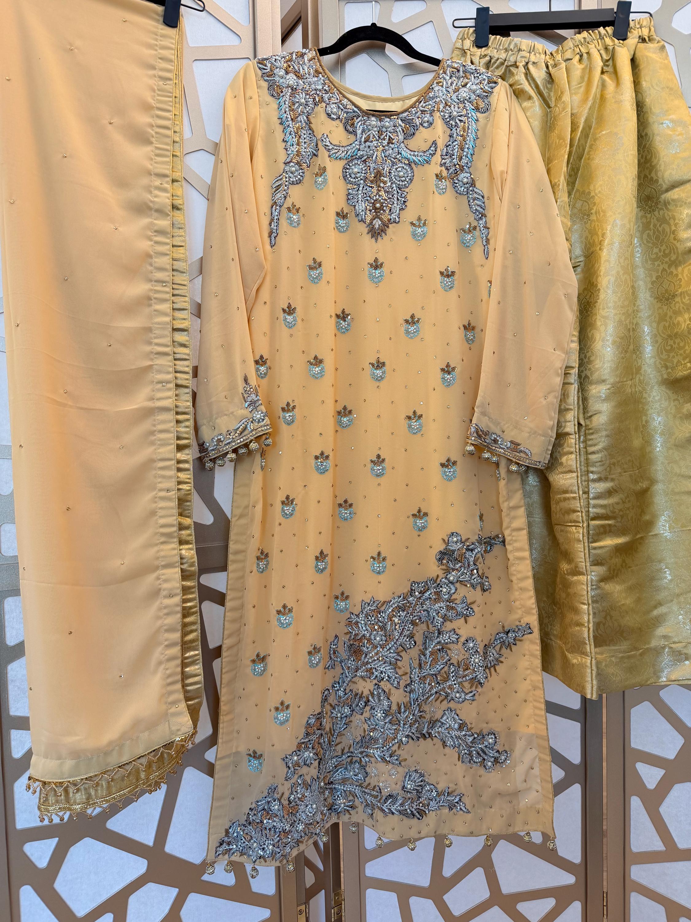 green emerald velvet dress Best Pakistani Bridal Dresses – Traditional & Modern Wedding Wear main image 1