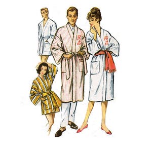 May include: Four people wearing striped and solid white bathrobes. The robes have a sash tie at the waist. The people are standing in a row. The person on the left is wearing a yellow and white striped robe. The person in the middle is wearing a pink and white striped robe. The person on the right is wearing a white robe with a red sash.