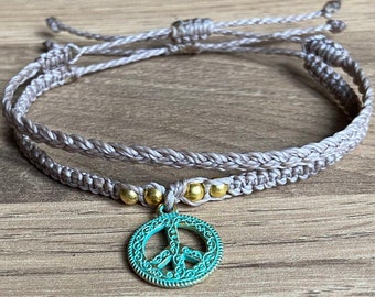 Beautiful neutral coloured peace bracelet stack