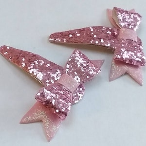 Glitter hairpins, clips, elastics and headband in bowstyle: in pink colors. image 5