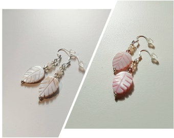 Silver earrings with shell feather pendant.