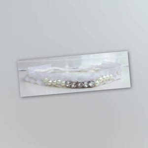 Grampo para recém-nascido: "Glitter" feito com miçangas e pérolas Swarovski.