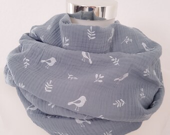 Loop scarf for spring made of muslin in gray with branches and bird motif