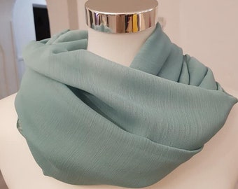 Boucle à ressort en uni turquoise